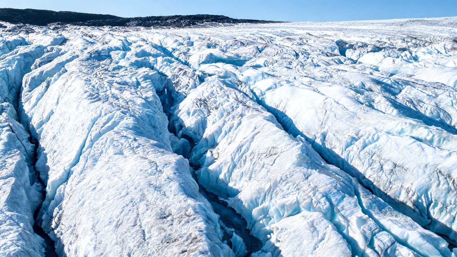 Ridged white ice and blue crevasses on the surface of the Vatnajokull glacier, Iceland