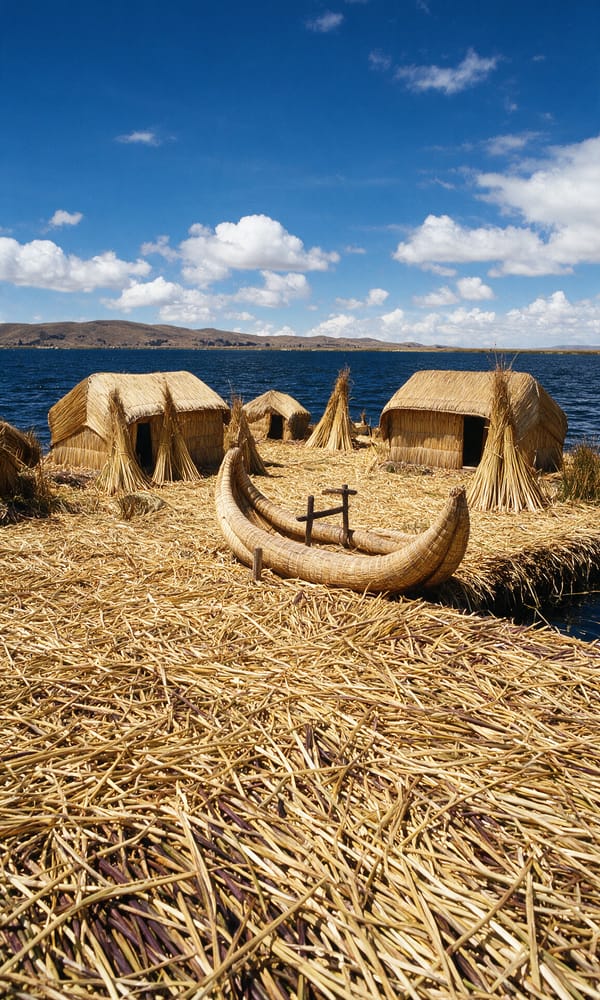 A reed boat moored at the edge of a Uros floating island on Lake Titicaca