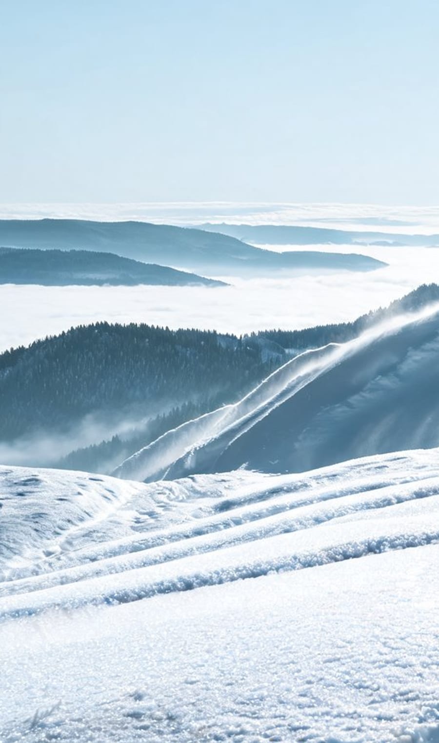 Wind-scoured snow across the ridgeline of Aspen Highlands, Colorado
