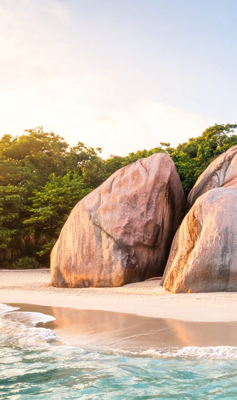 Weathered granite boulders on the sand at Anse Source d'Argent, La Digue