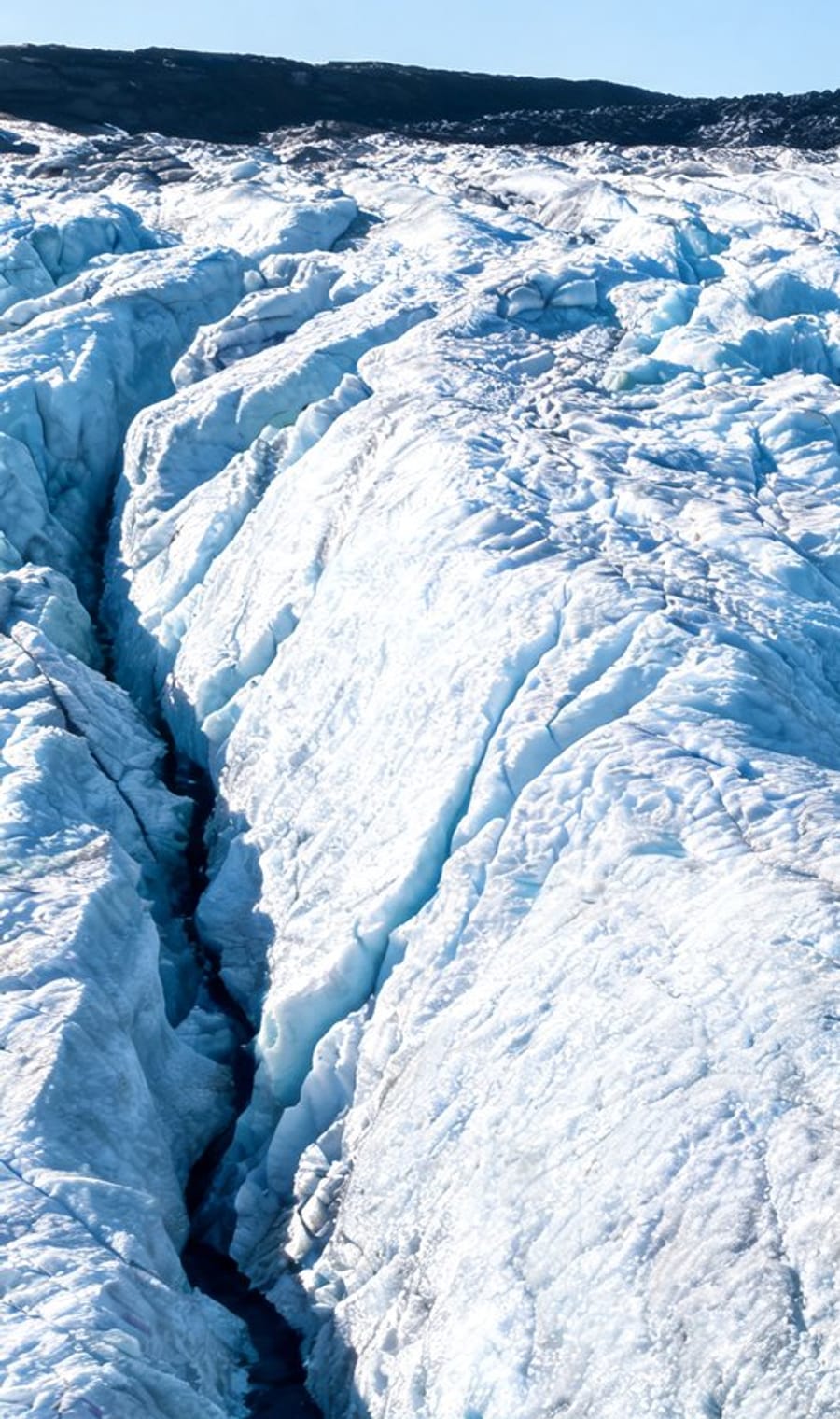 A blue crevasse splitting the surface of the Vatnajökull ice cap