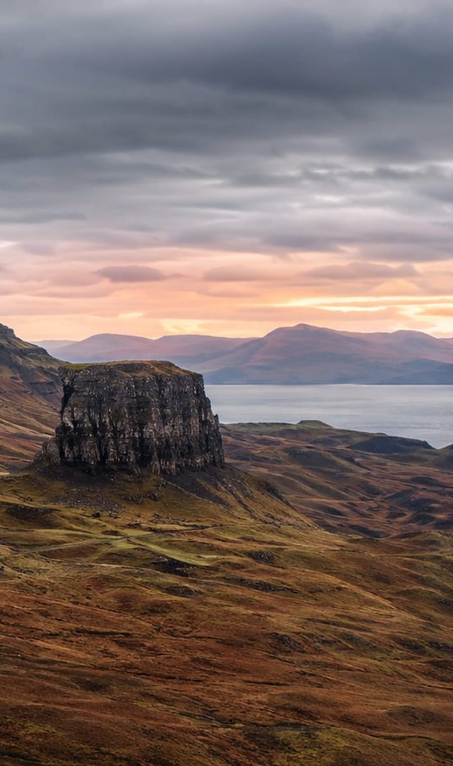 A flat-topped hill above still water in the Scottish Highlands